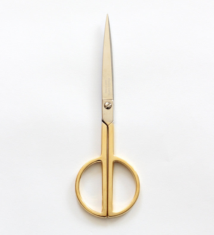 Realistic gold metal scissors. Closed and open stationery or